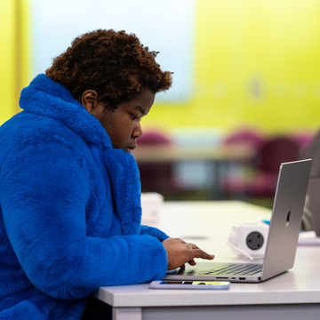 Lone student working with a laptop