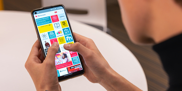 Student using the Edinburgh Napier app on a mobile phone.