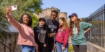A group of international students taking a selfie together
