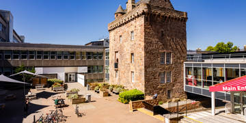 Merchiston main campus building and front courtyard on a bright sunny day