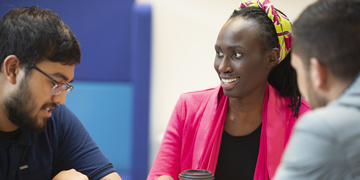 A group of students studying and talking