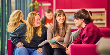 A group of students studying and talking