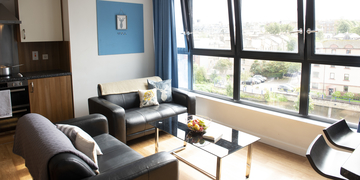 Student living room at Bainfield accommodation, with sofas and coffee table