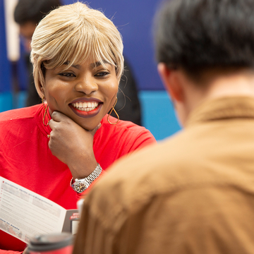 Close up of two students in conversation