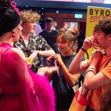 Students congregating around a stall during the Welcome Fair