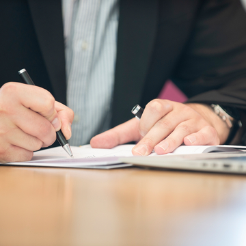 Writing with laptop in view