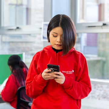 Image of Student Ambassador with mobile phone