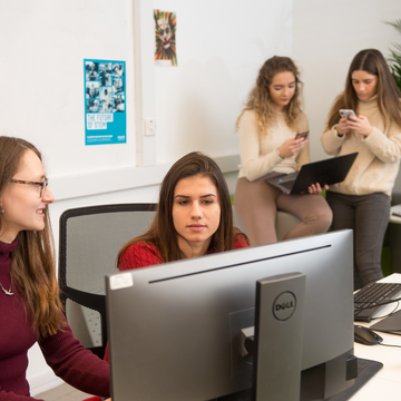 Students working together at computers
