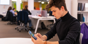 Student working on mobile phone
