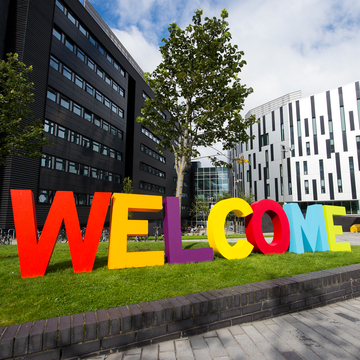 Large, colourful letters outside Sighthill building spelling the word 'Welcome'