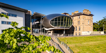 Craiglockhart main campus building and front lawn on a bright sunny day