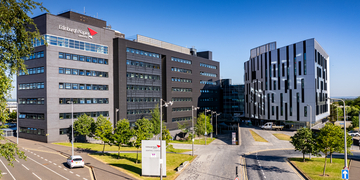 Sighthill main campus building and front lawn on a bright sunny day