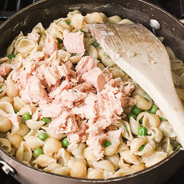 Tuna and pasta cooking in a pot