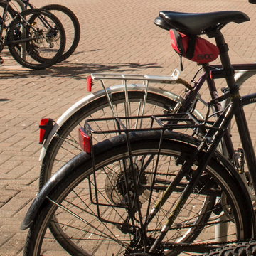 Close up of rear bike wheels and saddle