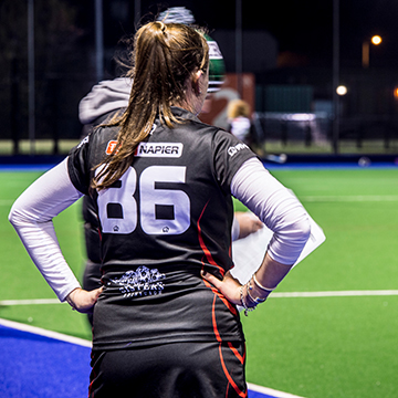 Student hockey player looking out over pitch