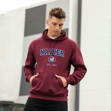 Student wearing maroon Edinburgh Napier branded hoodie