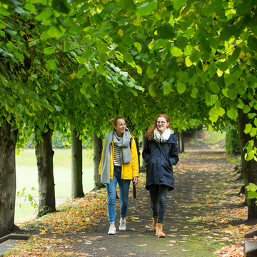 Students walking between trees in Craiglockhart grounds