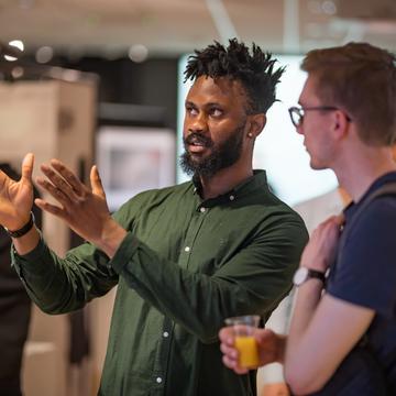 Two students talking at a networking event