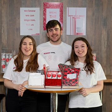 Product design students who designed dispenser for free period products on campus