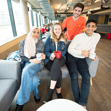 Students sitting together drinking tea and coffee