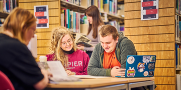 A group of students studying and talking